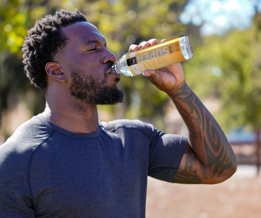 Patrick Willis drinking orange essence flavored nirvana super water