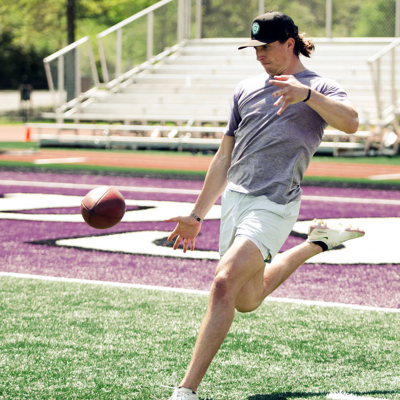 Tommy Townsend kicking football